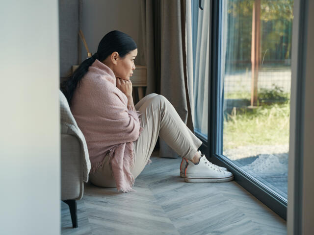 Woman sitting in isolation