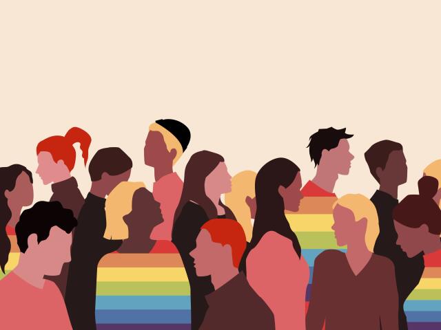 People gathered together with the rainbow color scheme as shirts for some of them.