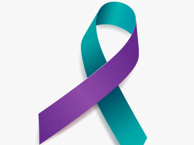 A blue and green ribbon symbolizing suicide loss survivors.